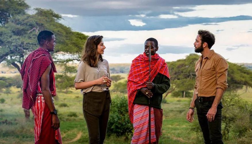 Couple listening to local in Africa